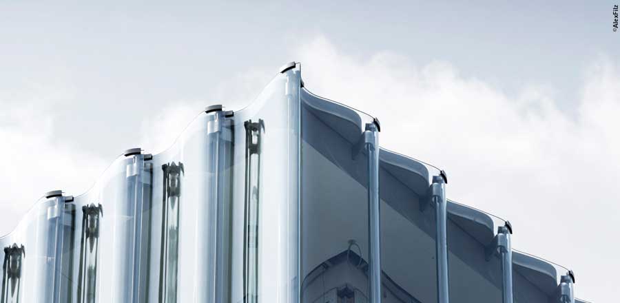 FRENER &amp; REIFER steel transom/mullion facade and undulating glass facade